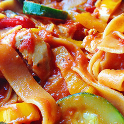 Chicken, Zucchini, and Pepper Pasta closeup stock image